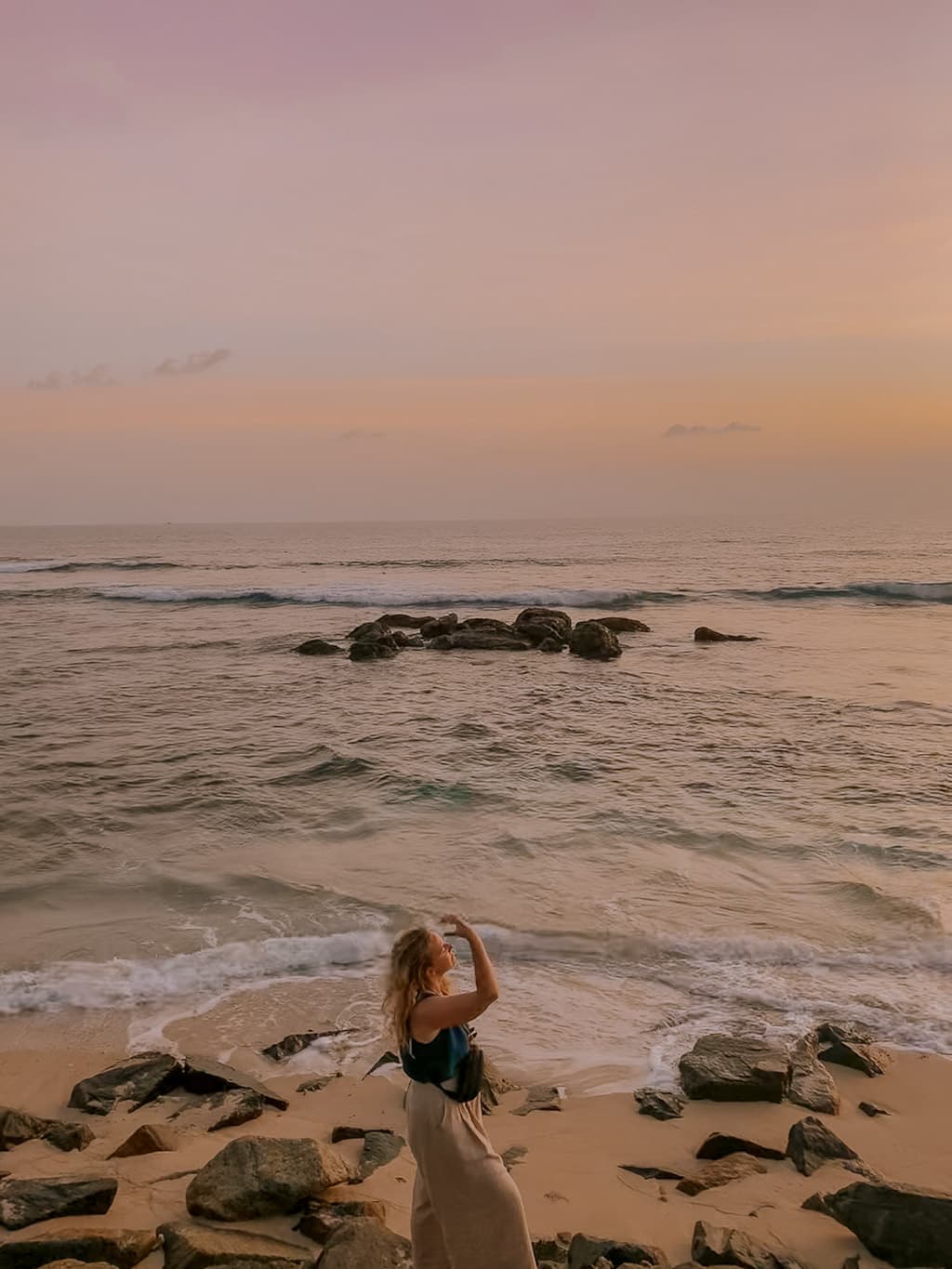 Weligama Beach with surfers enjoying the waves along Sri Lanka’s scenic southern coastline.