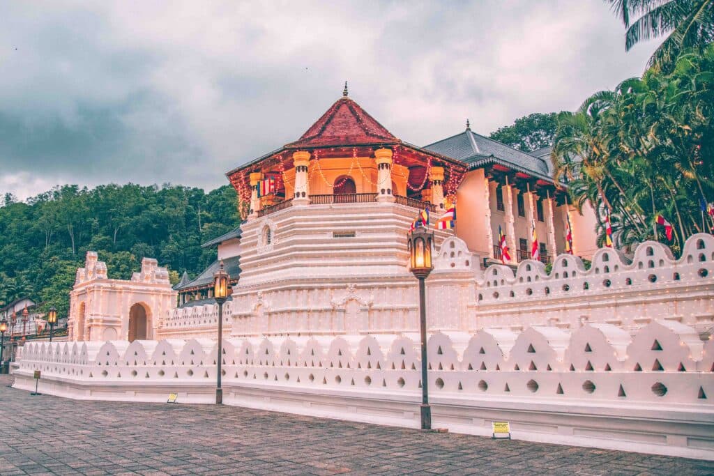 Scenic view of Kandy city with Kandy Lake and lush green hills in Sri Lanka