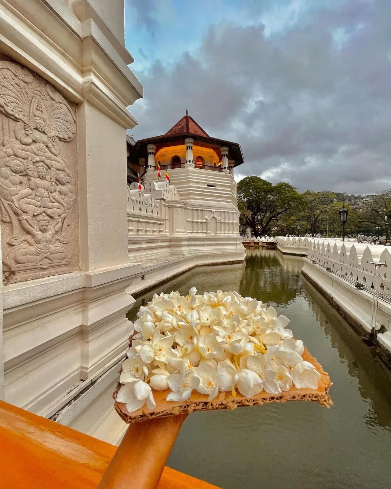 Scenic view of Kandy city with Kandy Lake and lush green hills in Sri Lanka